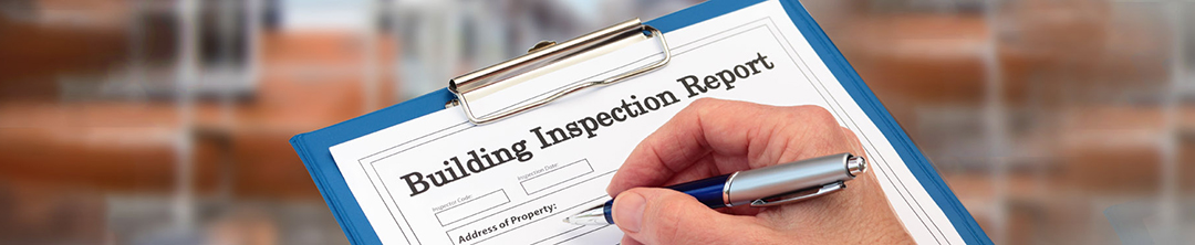 Building Inspector with an inspection report